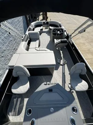 Slide: The Image of 2025 South Bay 224FCR LE pontoon boat with modern seating and steering console. - 6