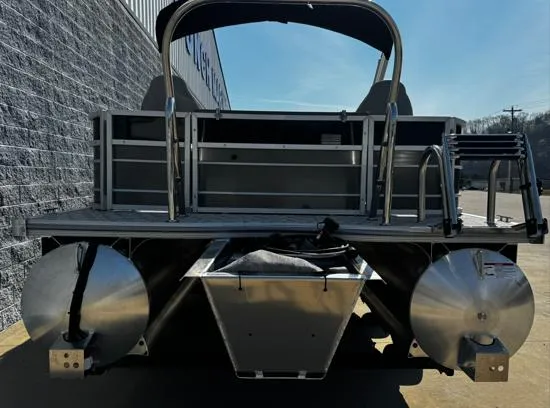 Slide: The Image of 2025 South Bay 224FCR LE pontoon boat rear view, showcasing dual pontoons and ladder. - 9