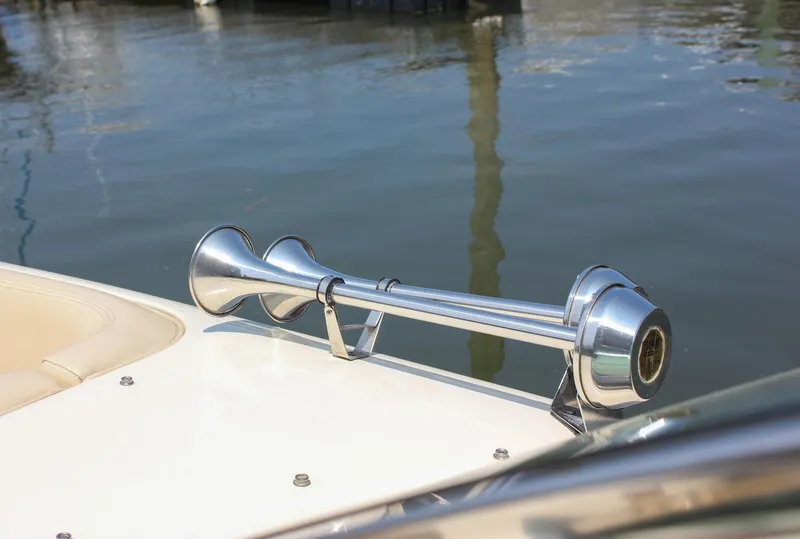Slide: The Image of 2016 Chris-Craft Launch 25 boat horn detail by the water. - 19