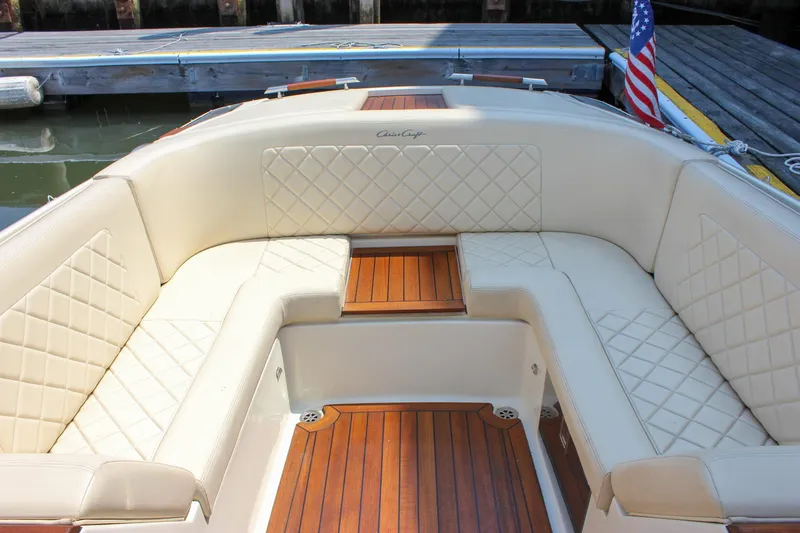 Slide: The Image of 2016 Chris-Craft Launch 25 boat interior with elegant seating and wooden flooring. - 25