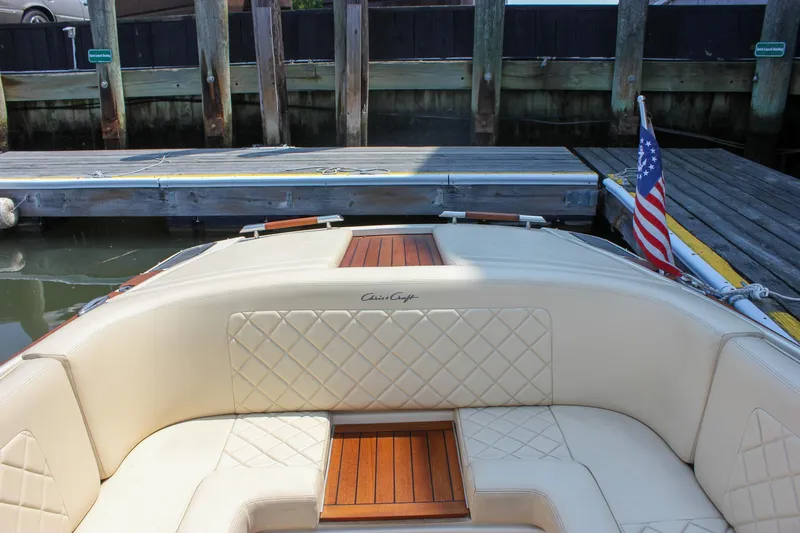 Slide: The Image of 2016 Chris-Craft Launch 25 boat interior with quilted seating and American flag. - 26