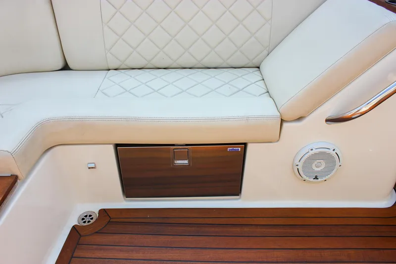 Slide: The Image of Luxurious 2016 Chris-Craft Launch 25 boat interior with quilted seating and teak flooring. - 27