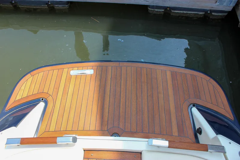 Slide: The Image of 2016 Chris-Craft Launch 25 swim platform with teak wood finish. - 31