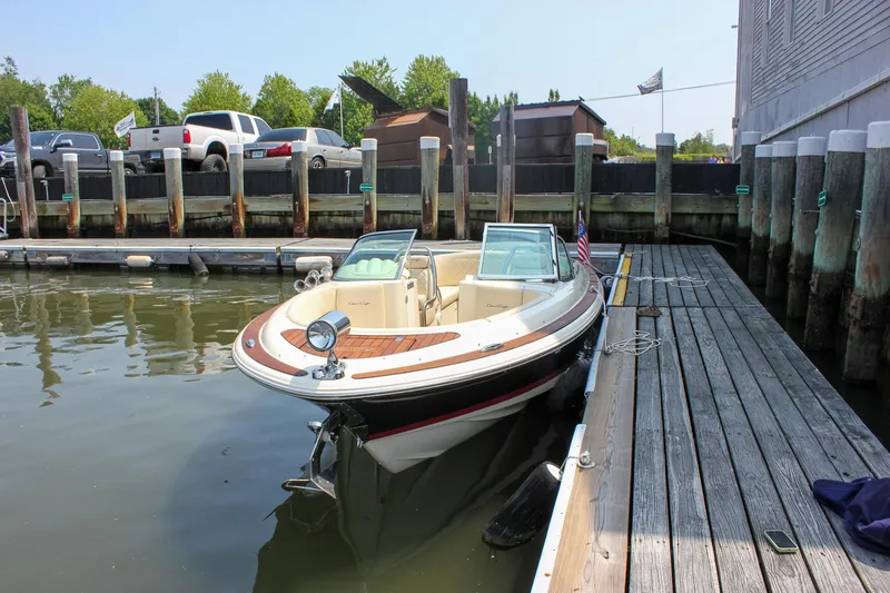Slide: The Image of 2016 Chris-Craft Launch 25 boat docked at a marina. - 39