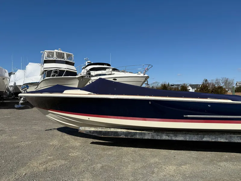 Slide: The Image of 2016 Chris-Craft Launch 25 boat on display, with other boats in the background. - 43