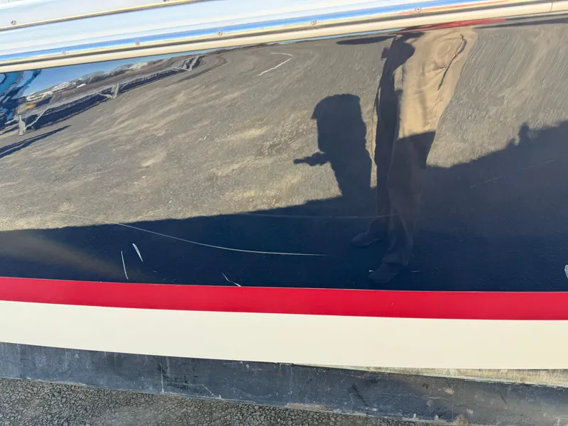Slide: The Image of 2016 Chris-Craft Launch 25 boat with visible scratches on the hull. - 47