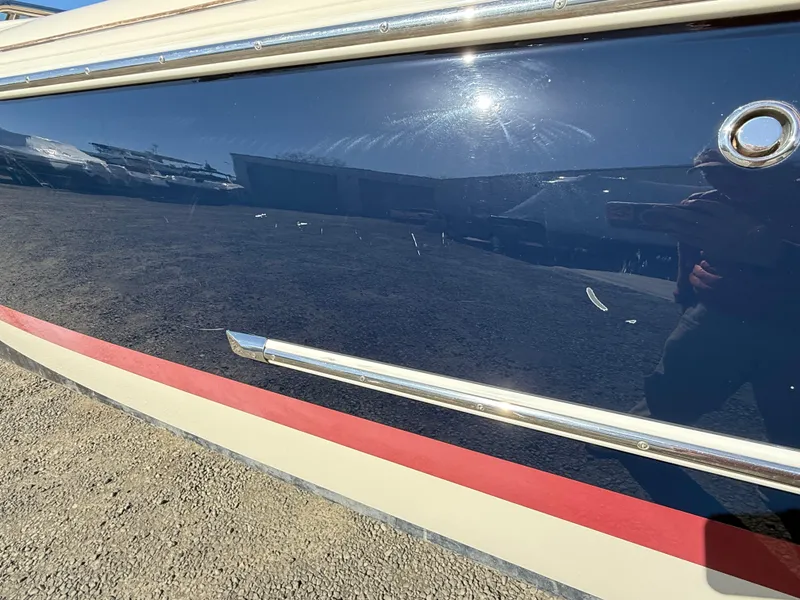 Slide: The Image of 2016 Chris-Craft Launch 25 boat hull with sleek design and reflective surface. - 48