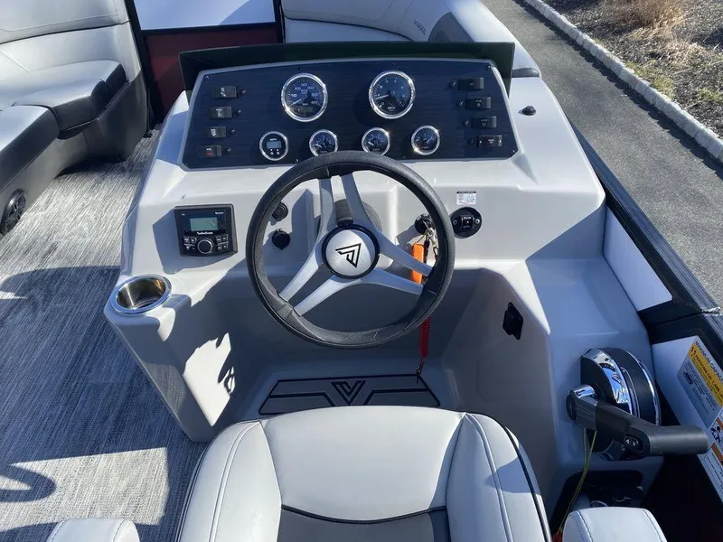 Slide: The Image of 2023 Viaggio Lago U L20U boat dashboard with steering wheel and control panel. - 12