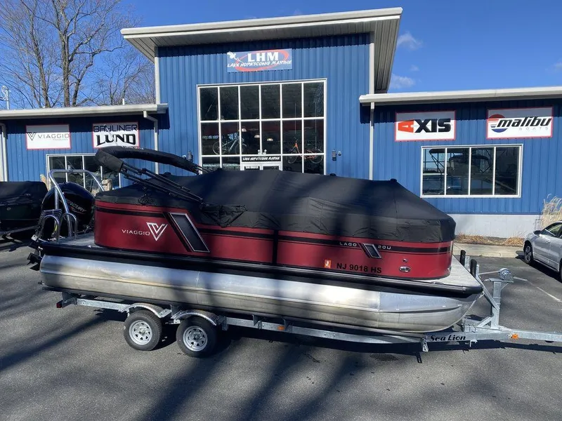 Slide: The Image of 2023 Viaggio Lago U L20U pontoon boat on trailer outside dealership. - 14