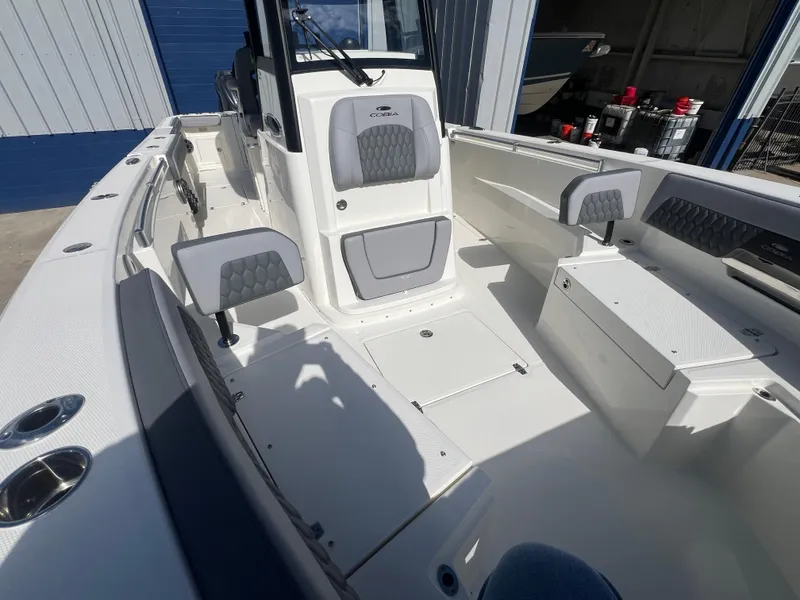 Slide: The Image of 2025 Cobia 285 Open Center Console boat with spacious seating and modern design. - 16