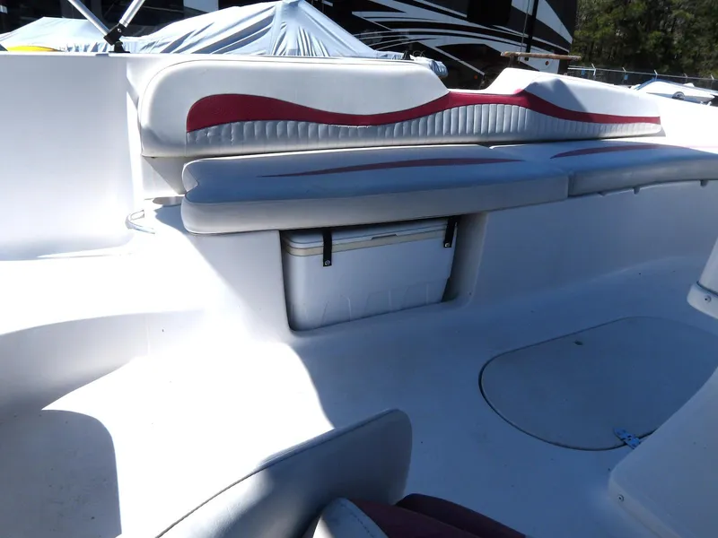 Slide: The Image of 2008 Starcraft Stardeck 200 boat interior with cushioned seating and storage compartment. - 13