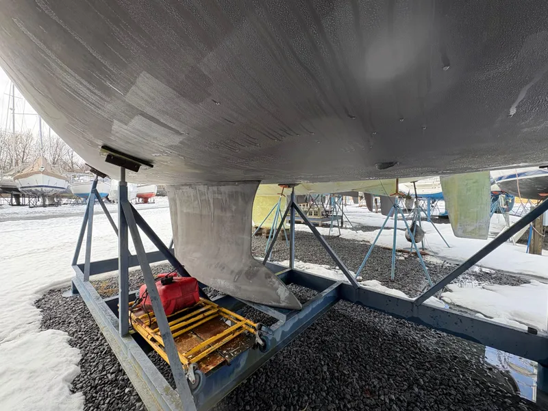 Slide: The Image of Beneteau Oceanis 40 sailboat keel on stand, 2011 model, winter storage. - 2