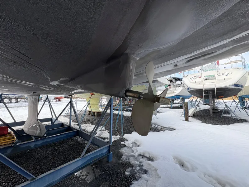 Slide: The Image of Beneteau Oceanis 40 sailboat, 2011 model, on stands in snowy boatyard. - 3