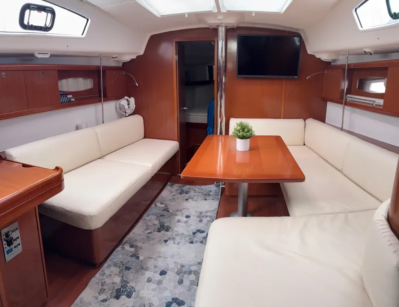 Slide: The Image of Interior of 2011 Beneteau Oceanis 40 yacht with cozy seating and modern decor. - 7