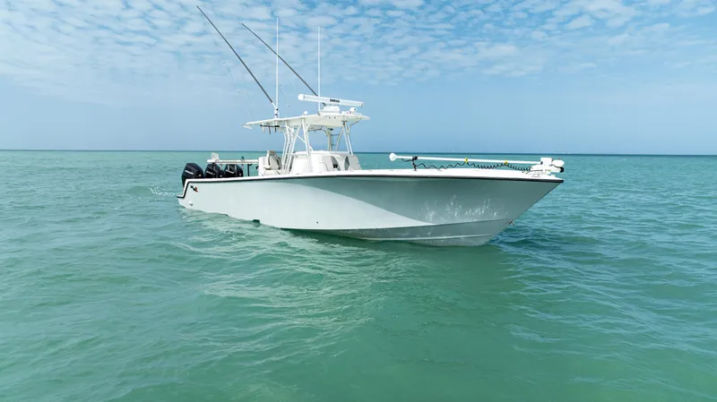 Slide: The Image of 2015 SeaVee 390Z boat on calm ocean waters under a partly cloudy sky. - 10