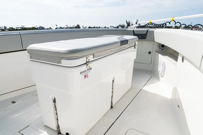 Slide: The Image of 2015 SeaVee 390Z boat deck with cushioned storage bench. - 13