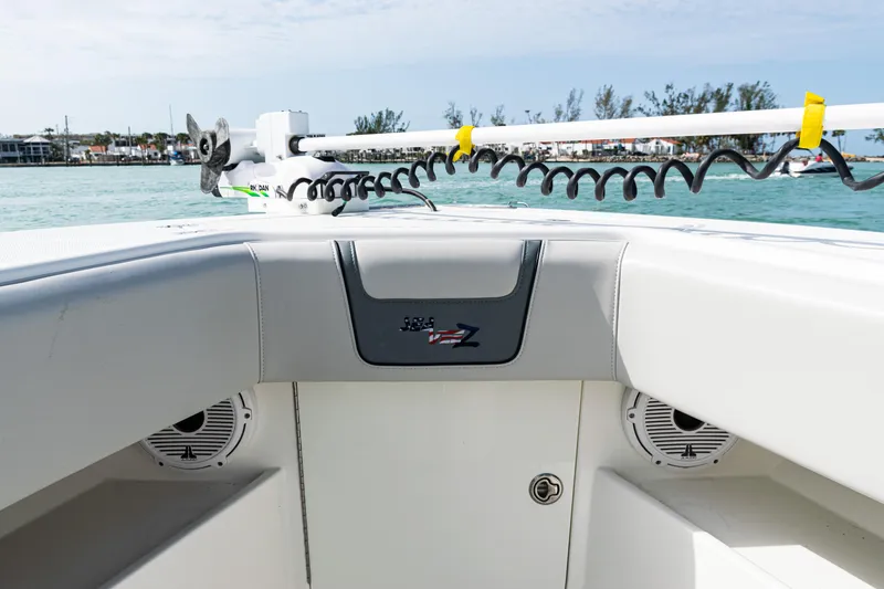 Slide: The Image of 2015 SeaVee 390Z boat interior with speakers and equipment, on calm water. - 14