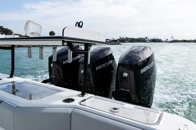 Slide: The Image of 2015 SeaVee 390Z boat with triple Mercury outboard engines on the water. - 16