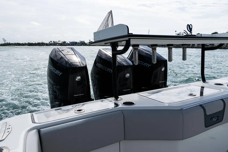 Slide: The Image of 2015 SeaVee 390Z boat with triple Mercury engines on the water. - 17