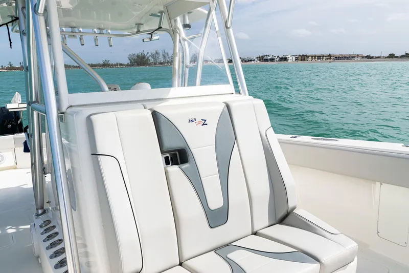 Slide: The Image of 2015 SeaVee 390Z boat interior with sleek seating, ocean view, and modern design. - 19