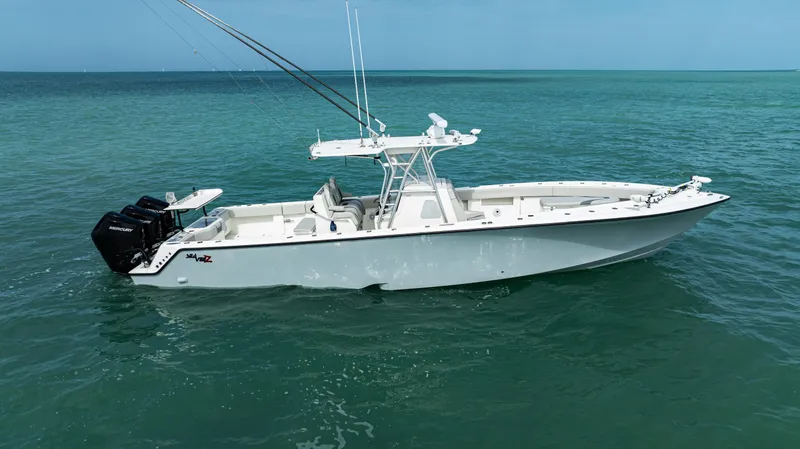 Slide: The Image of 2015 SeaVee 390Z boat on calm ocean waters. - 2