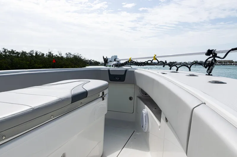 Slide: The Image of 2015 SeaVee 390Z boat interior with seating, rod holders, and ocean view. - 30