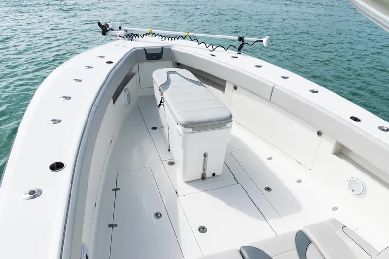 Slide: The Image of 2015 SeaVee 390Z boat deck with seating and storage, on calm water. - 33