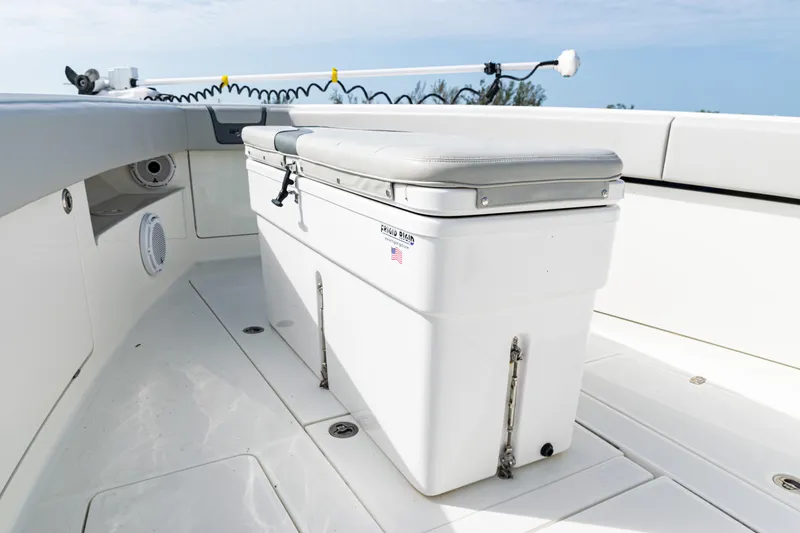Slide: The Image of 2015 SeaVee 390Z boat deck with cushioned storage bench. - 34