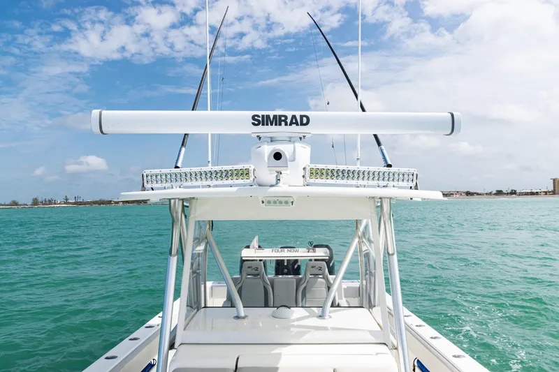 Slide: The Image of 2015 SeaVee 390Z boat with Simrad equipment on turquoise water under blue sky. - 43