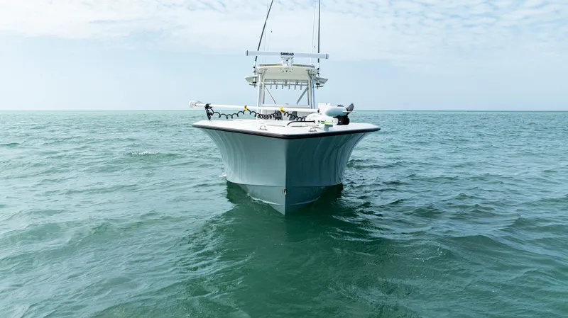 Slide: The Image of 2015 SeaVee 390Z boat on open water under a cloudy sky. - 8
