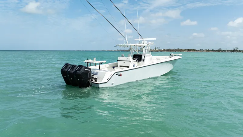 Slide: The Image of 2015 SeaVee 390Z boat with multiple engines on turquoise water under blue sky. - 9