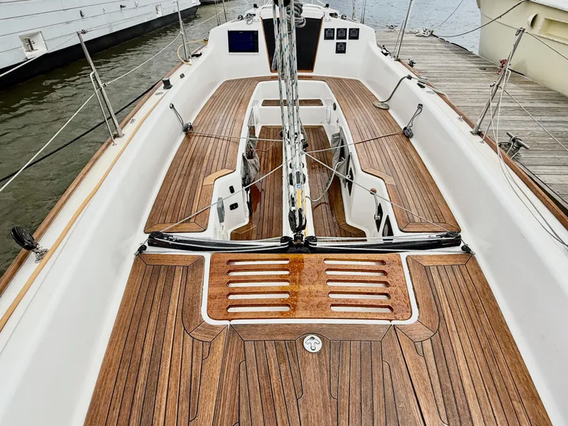 Slide: The Image of 2009 e Sailing Yachts e33 with sleek wooden deck and modern design. - 11
