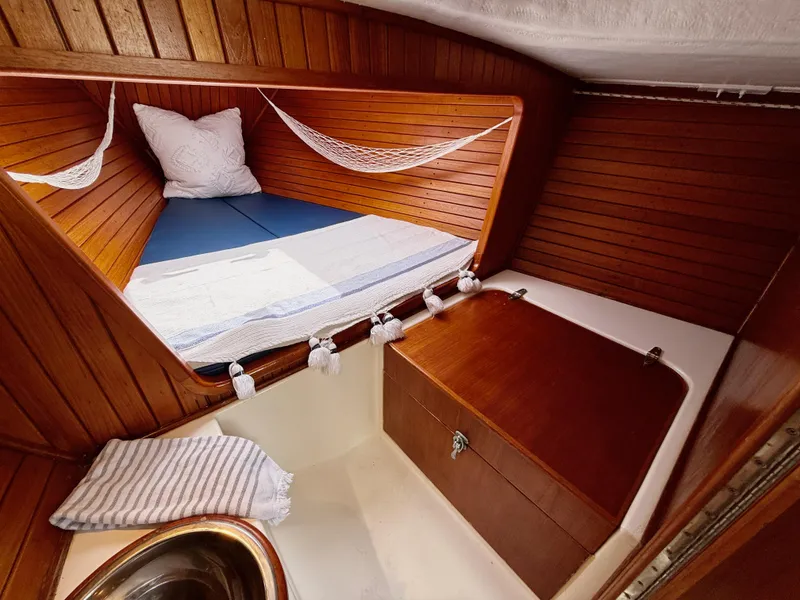 Slide: The Image of Cozy cabin interior of 2009 e Sailing Yachts e33 with wooden finish and bedding. - 24