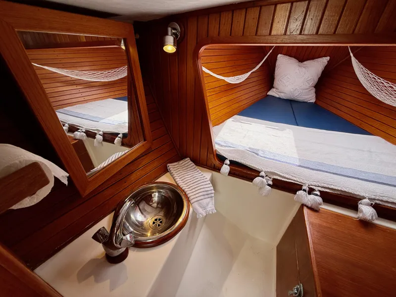 Slide: The Image of Cozy cabin interior of 2009 e Sailing Yachts e33 with wooden finish and compact sink. - 25