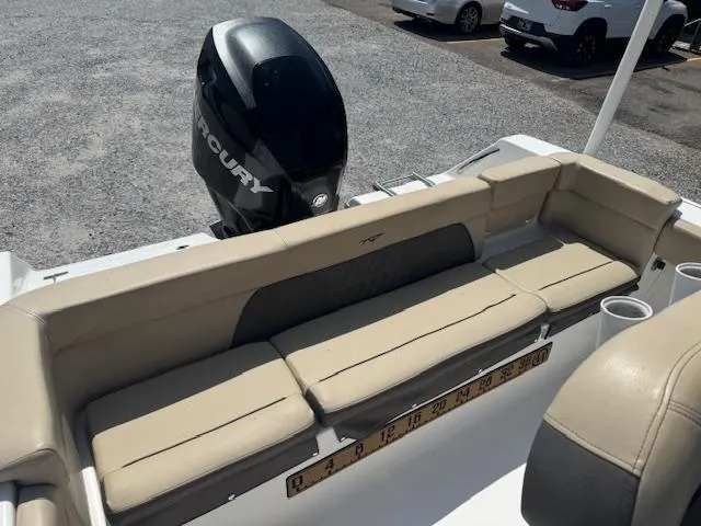 Slide: The Image of 2018 Tidewater 220 LXF boat with Mercury engine and beige seating. - 13