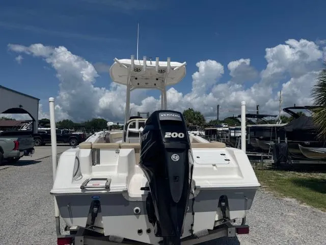 Slide: The Image of 2018 Tidewater 220 LXF boat with Yamaha 200 engine, parked outdoors under a blue sky. - 9