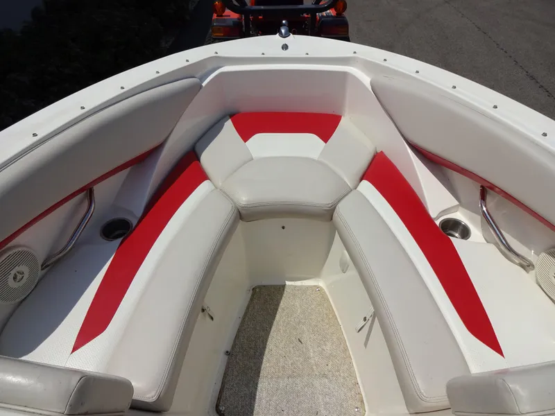 Slide: The Image of 2007 Larson 206 Senza boat interior with red and white seating. - 13