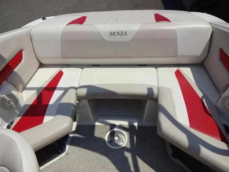 Slide: The Image of 2007 Larson 206 Senza boat interior with white and red seating. - 7
