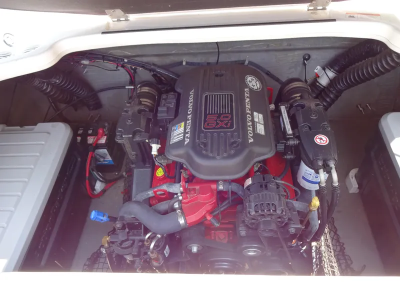 Slide: The Image of 2007 Larson 206 Senza boat engine compartment with Volvo Penta engine. - 8