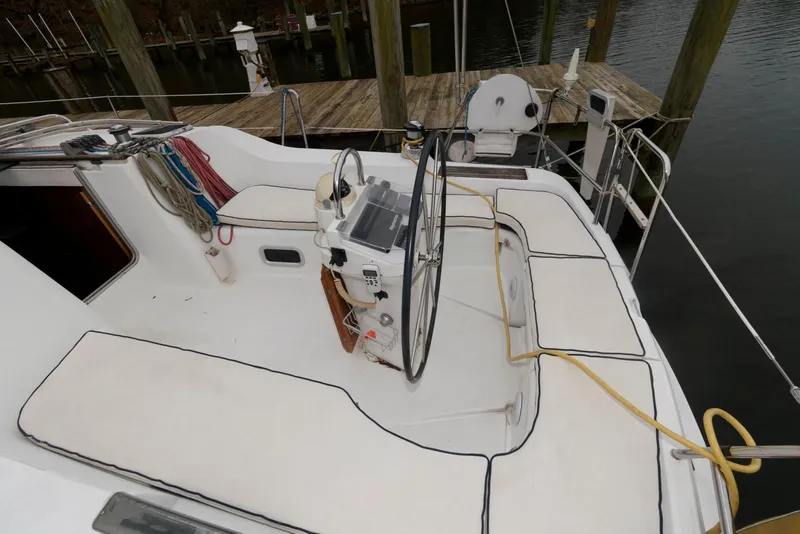 Slide: The Image of Cockpit of 2002 Beneteau 393 sailboat with steering wheel and seating. - 5