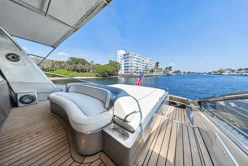 Slide: The Image of Luxurious 2003 Baia Panther 80 yacht deck with scenic waterfront view. - 16