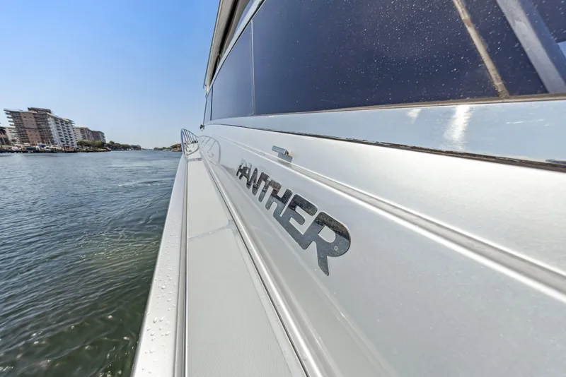 Slide: The Image of 2003 Baia Panther 80 yacht on water, side view with logo. - 20