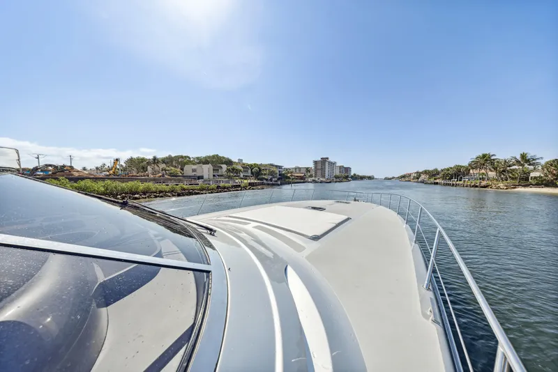 Slide: The Image of 2003 Baia PANTHER 80 yacht cruising on a sunny day, coastal view. - 23