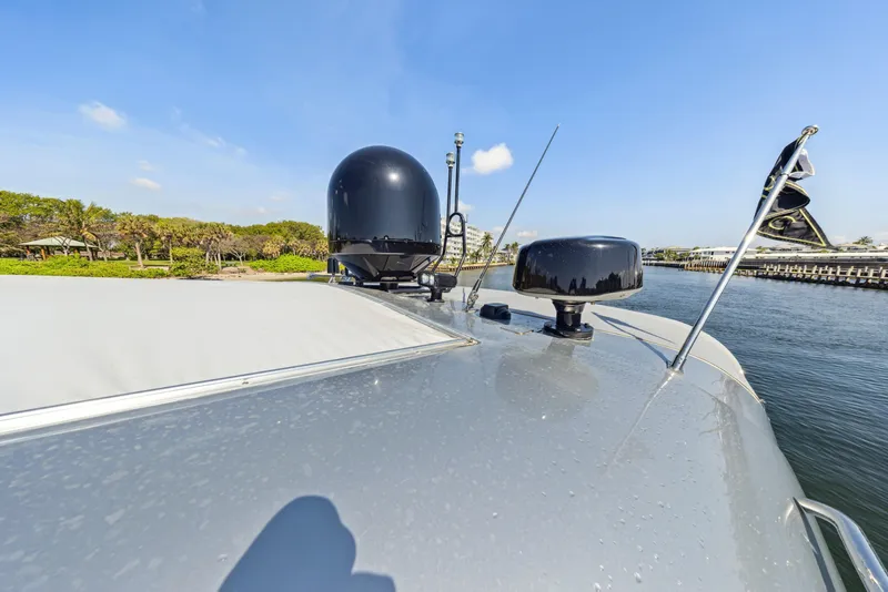 Slide: The Image of 2003 Baia PANTHER 80 yacht deck with radar and antennas under clear blue sky. - 25