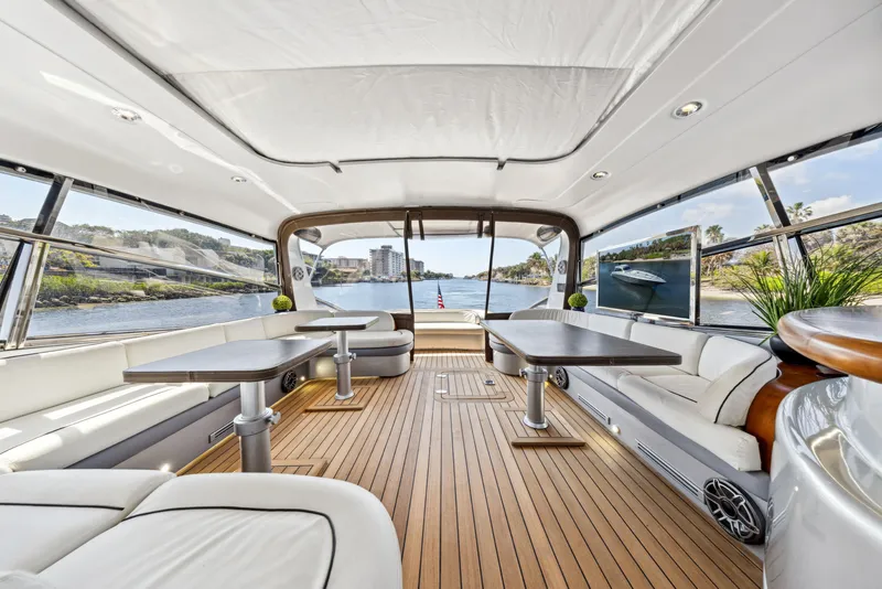 Slide: The Image of Luxurious interior of 2003 Baia Panther 80 yacht with elegant seating and scenic views. - 26