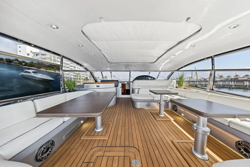 Slide: The Image of Luxurious interior of 2003 Baia Panther 80 yacht with sleek design and wooden flooring. - 30