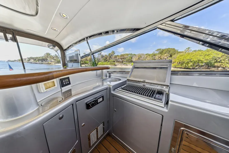 Slide: The Image of Luxury yacht kitchen on 2003 Baia PANTHER 80 with outdoor grill and scenic view. - 32