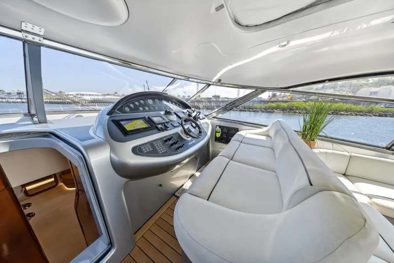Slide: The Image of Luxurious interior of 2003 Baia Panther 80 yacht with modern helm and seating. - 33