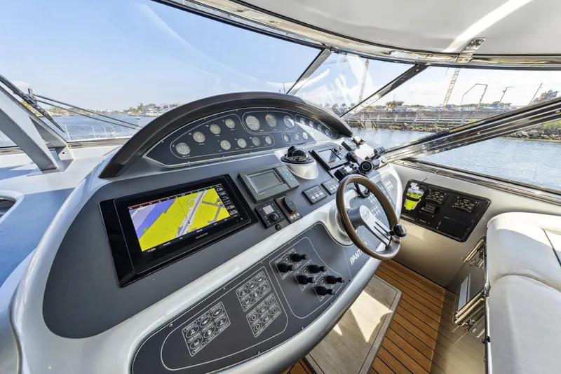 Slide: The Image of Cockpit of 2003 Baia PANTHER 80 yacht with navigation controls and steering wheel. - 35