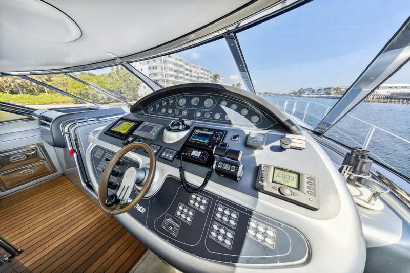 Slide: The Image of Cockpit of 2003 Baia Panther 80 yacht with advanced navigation controls and wooden flooring. - 36
